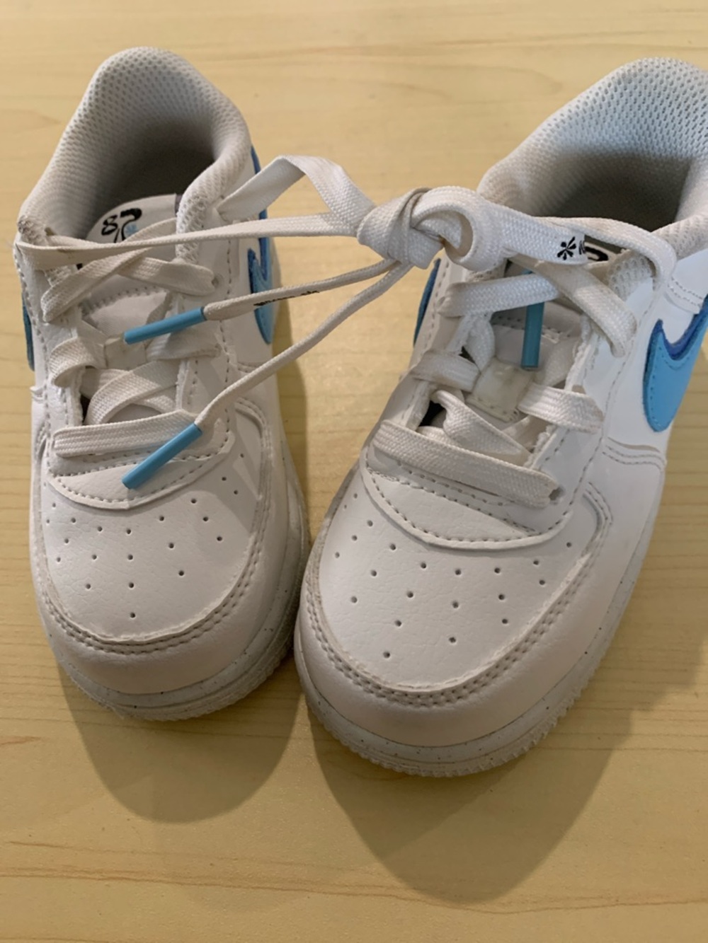 Kids White Sneakers with Light Blue Accent - Nike